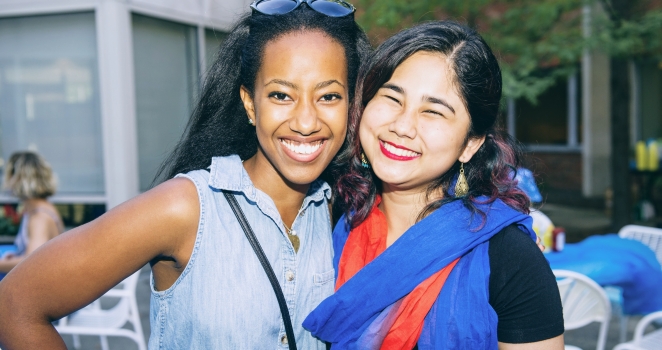 Two smiling students from CSDI at program.