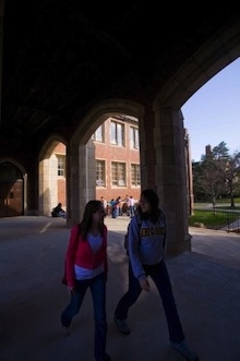 two college students walking in the college courtyard