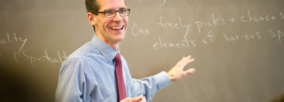 Edward Hahnenberg teaching at the chalk board.