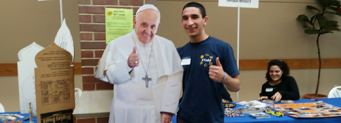 photo if a teenager with a Pope Francis cutout