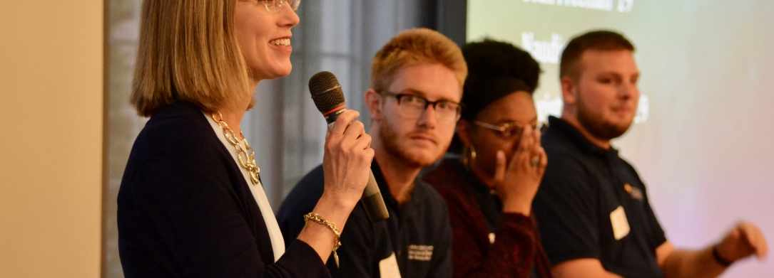 a woman talking on the microphone