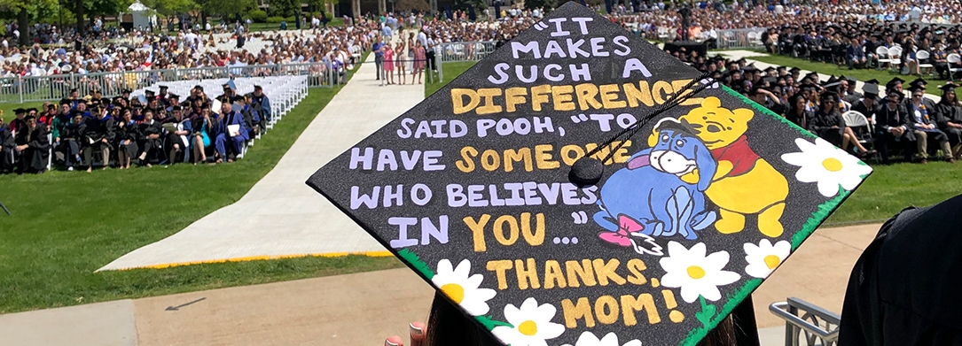 Decorated graduation cap featuring Winnie the Pooh and Eeyore that reads, "It makes such a difference," said Pooh, "to have someone who believes in you ..." Thanks, Mom!