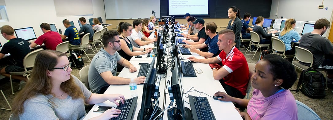 Marketing class in a computer lab working on a project