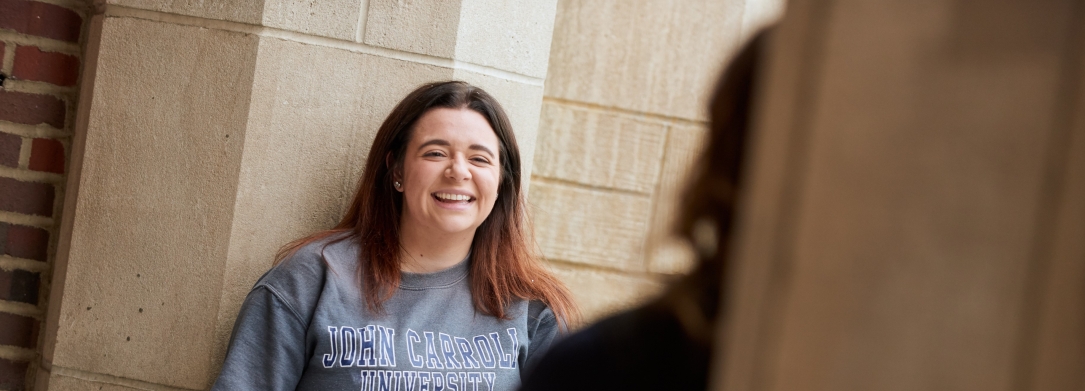 JCU Student outside laughing