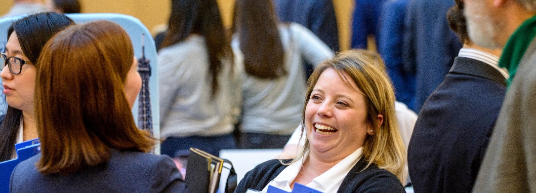 women talking at a conference