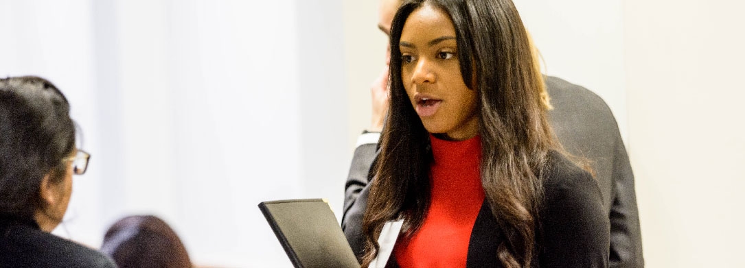 woman holding a notepad