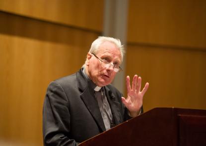 Archbishop Fitzgerald gives his lecture in Donahue Auditorium. 