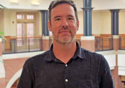 Watling stands in the Dolan Science Center