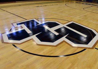 The center court logo in the DeCarlo Center - the new JCU athletics logo