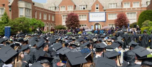 Banner image of a crowd of JCU graduates