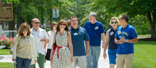 Group of JCU alumni walking on campus