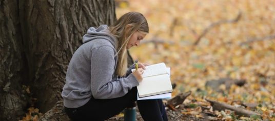 Student reflecting on a retreat.